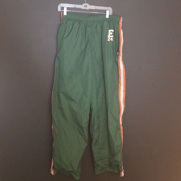 green and orange track pants